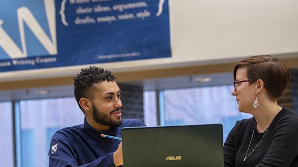 Student being tutored at the Writing Center